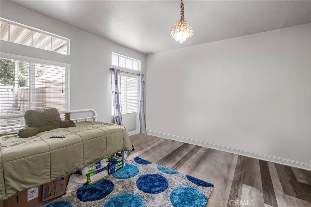 2139 East 4th Street, Unit 84 Ontario, CA 91764 - Photo 18 of 25 a bed room with a bed and a window