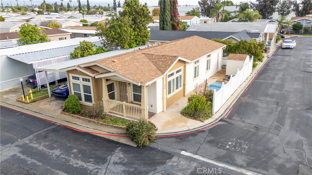 2139 East 4th Street, Unit 84 Ontario, CA 91764 - Photo 2 of 25 an aerial view of a house with a yard