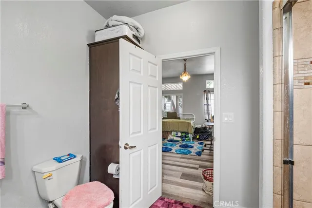 a view of a hallway to a livingroom and a dining room with furniture