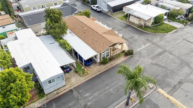 an aerial view of a house with outdoor space