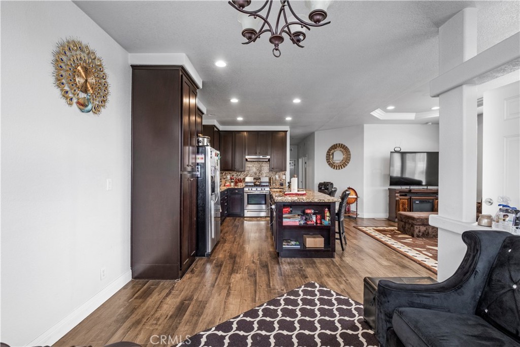 2139 East 4th Street, Unit 84 Ontario, CA 91764 - Photo 9 of 25 a living room with furniture kitchen view and a window