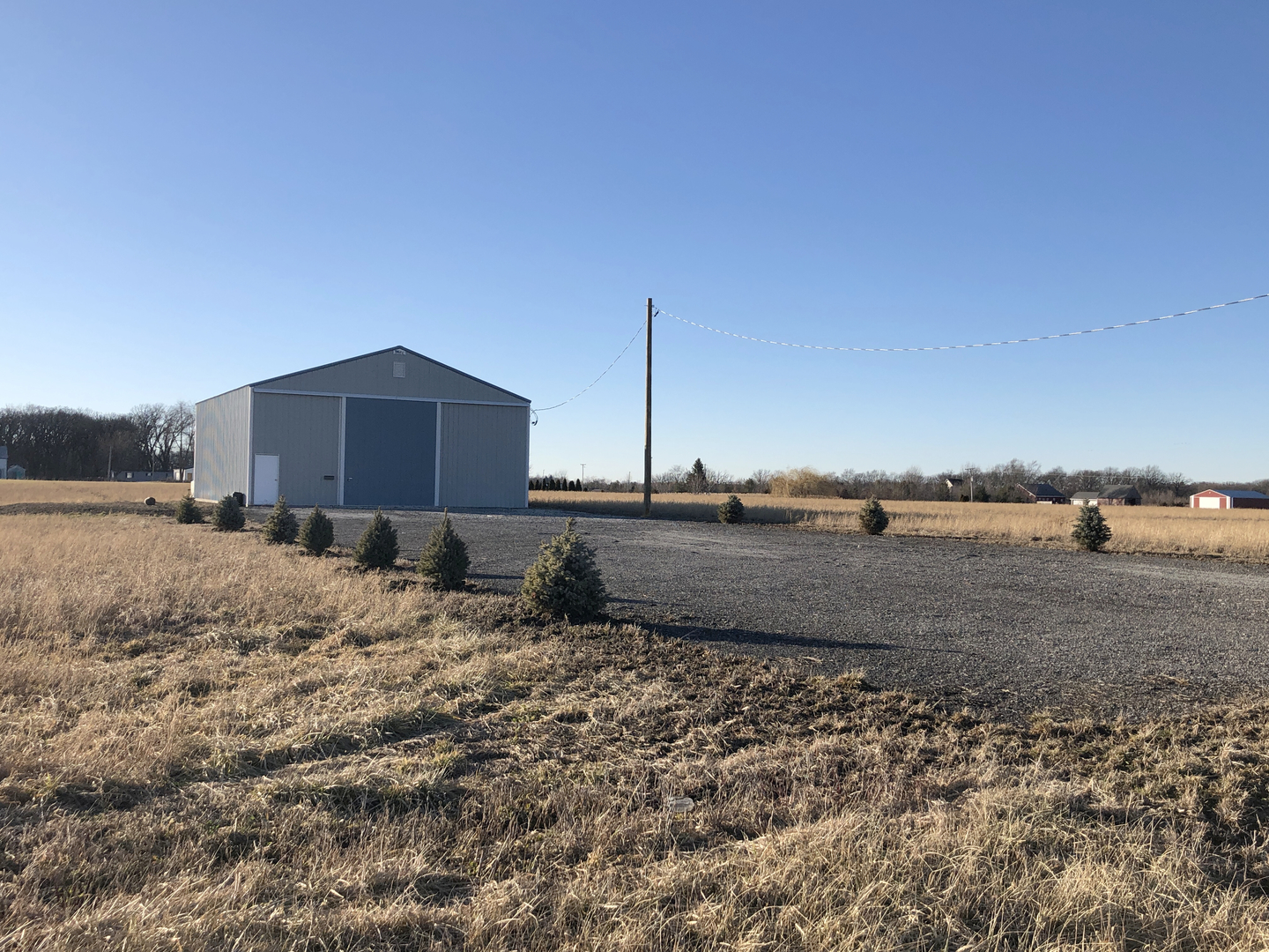 3175 East Brunswick Road Beecher, IL 60401 - Photo 1 of 6 a view of a dry yard with wooden fence
