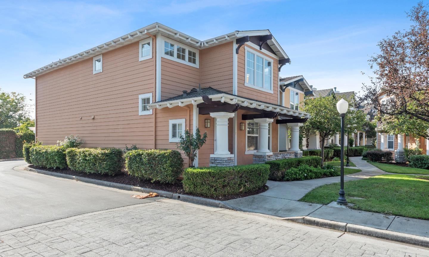 72 Cannery Circle Campbell, CA 95008 - Photo 1 of 20 a front view of a house with a yard and potted plants