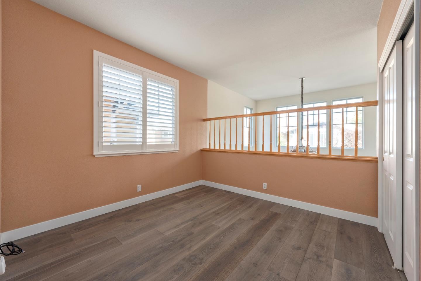 72 Cannery Circle Campbell, CA 95008 - Photo 14 of 20 a view of an empty room with wooden floor and a window