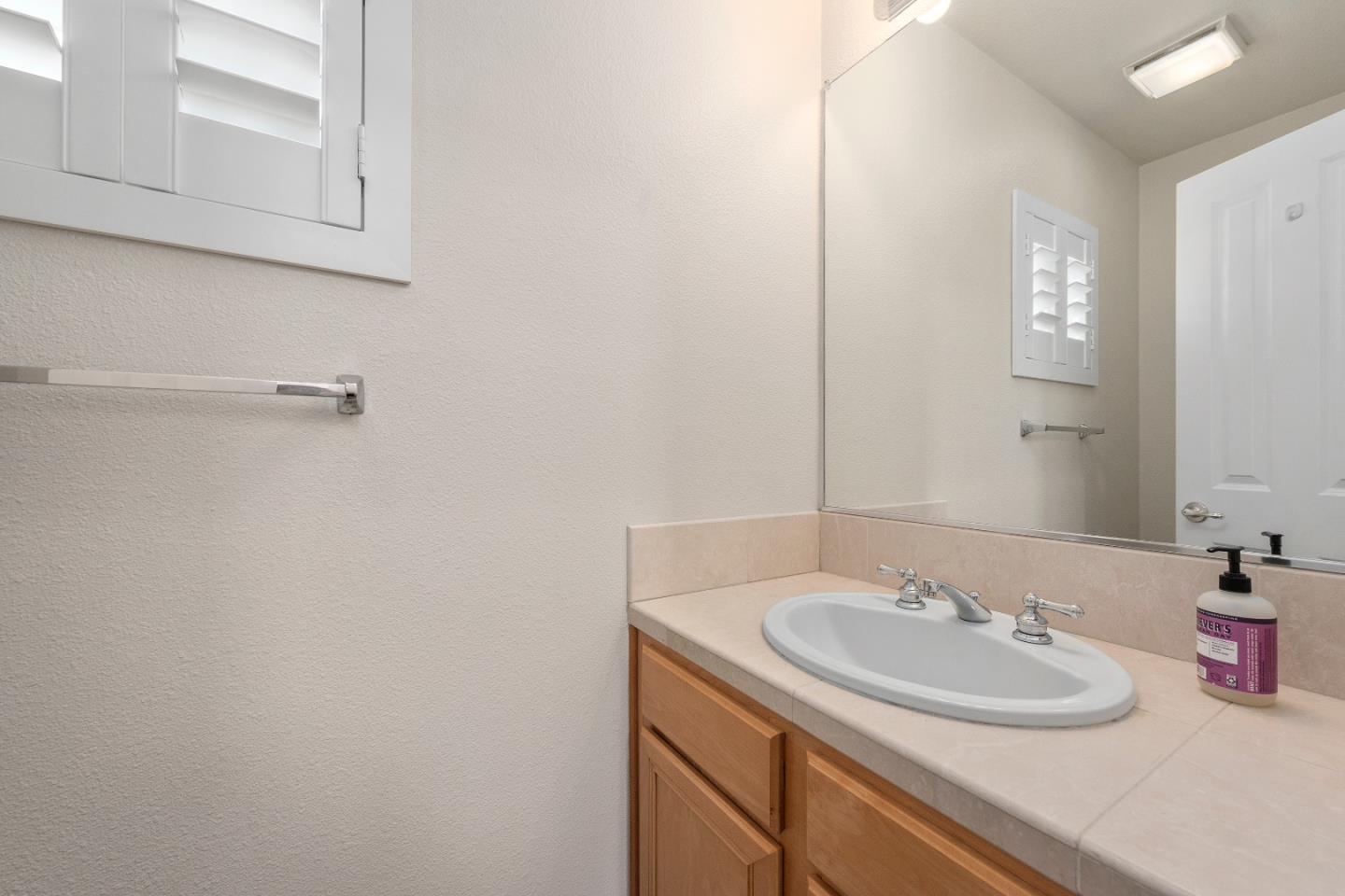 72 Cannery Circle Campbell, CA 95008 - Photo 16 of 20 a bathroom with a sink and a mirror