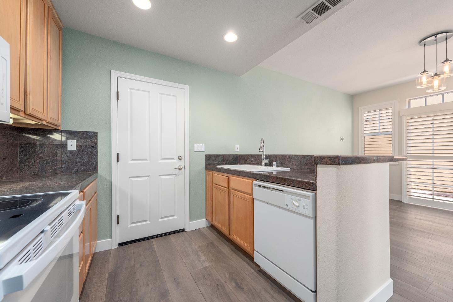 72 Cannery Circle Campbell, CA 95008 - Photo 5 of 20 a kitchen with a sink stove and cabinets