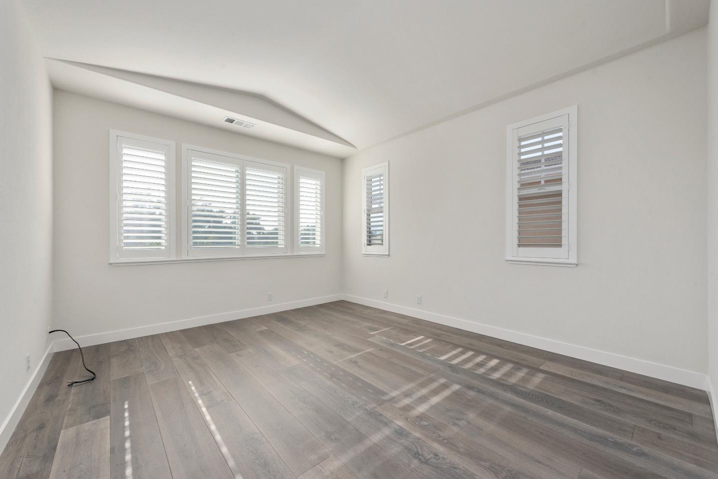 72 Cannery Circle Campbell, CA 95008 - Photo 10 of 20 a view of an empty room with wooden floor and a window