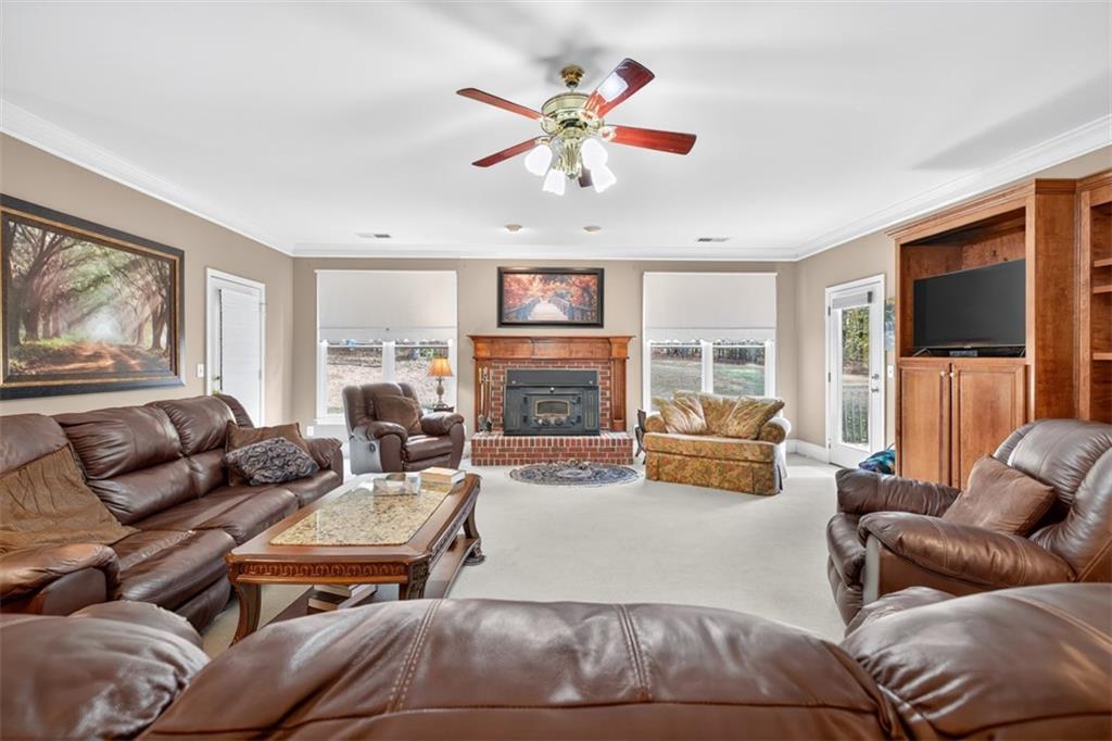 3357 Rising Fawn Trail Suwanee, GA 30024 - Photo 11 of 93 a living room with furniture fireplace and flat screen tv