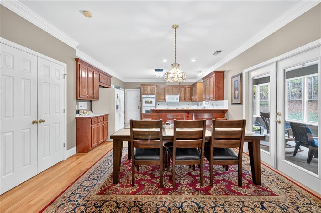 3357 Rising Fawn Trail Suwanee, GA 30024 - Photo 13 of 93 a view of a dining room with furniture
