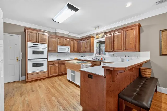 a bedroom with a bed couch and a window