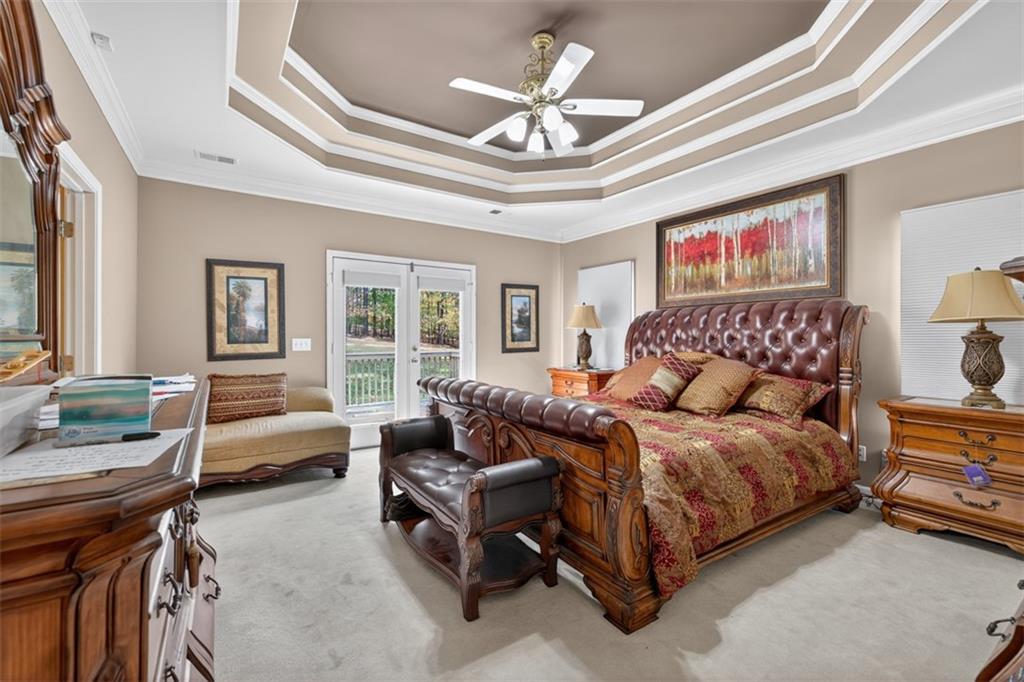 3357 Rising Fawn Trail Suwanee, GA 30024 - Photo 24 of 93 a bedroom with a bed couch and a window