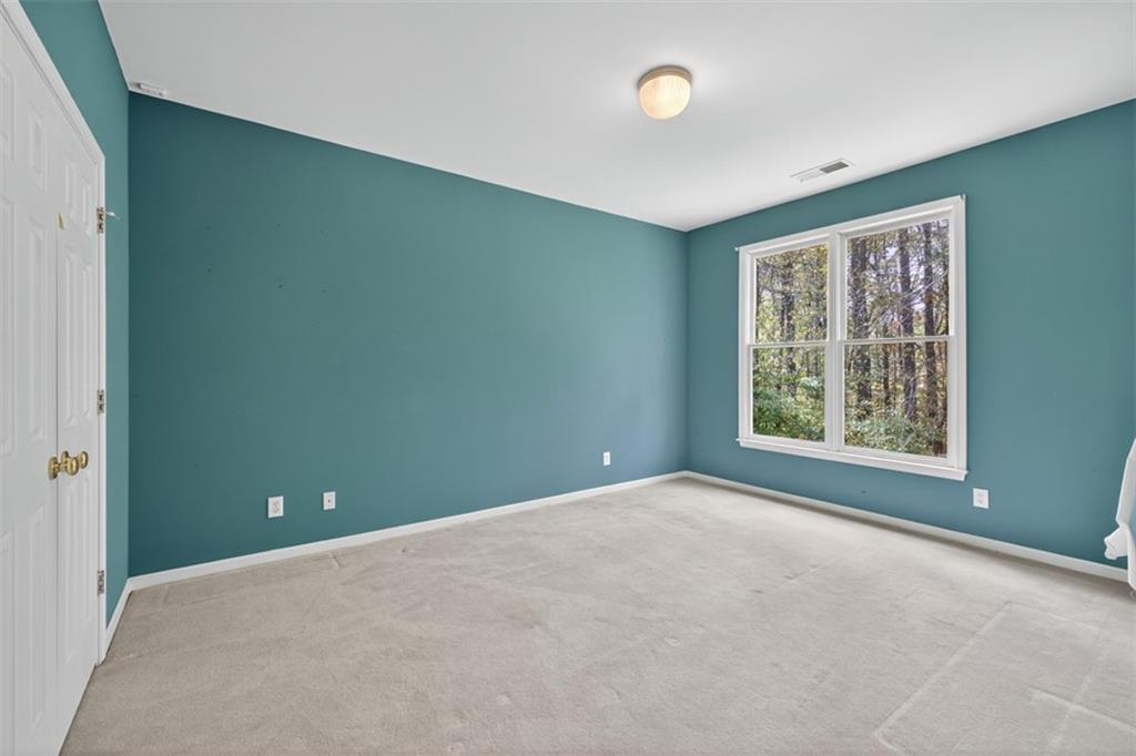 3357 Rising Fawn Trail Suwanee, GA 30024 - Photo 30 of 93 an empty room with windows and closet