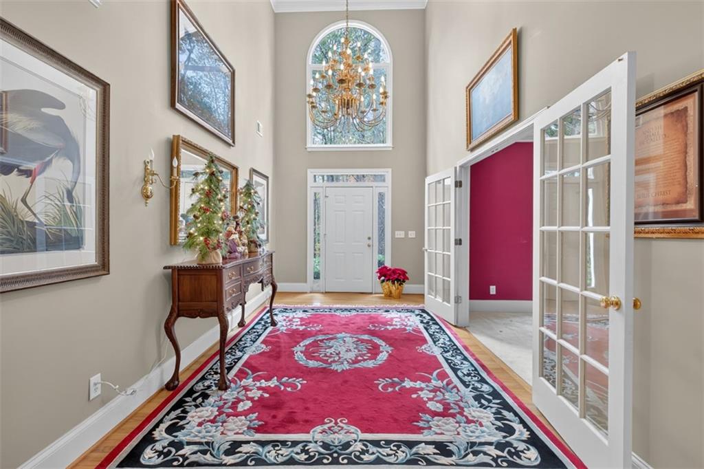 3357 Rising Fawn Trail Suwanee, GA 30024 - Photo 3 of 93 a picture of a room with furniture and wooden floor