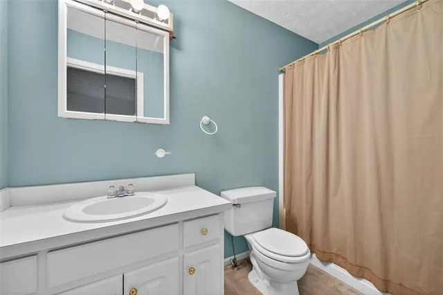 a view of yard with large trees