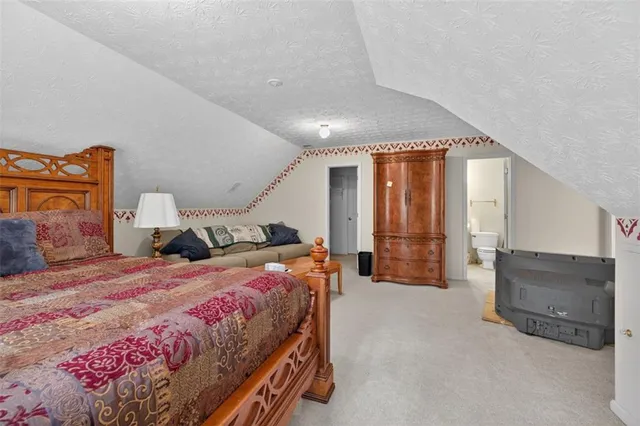 a view of a house with a yard and balcony