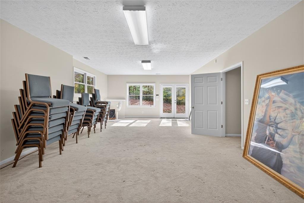 3357 Rising Fawn Trail Suwanee, GA 30024 - Photo 47 of 93 a view of a livingroom with furniture and a window