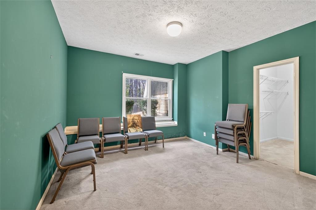 3357 Rising Fawn Trail Suwanee, GA 30024 - Photo 52 of 93 a living room with furniture and a window