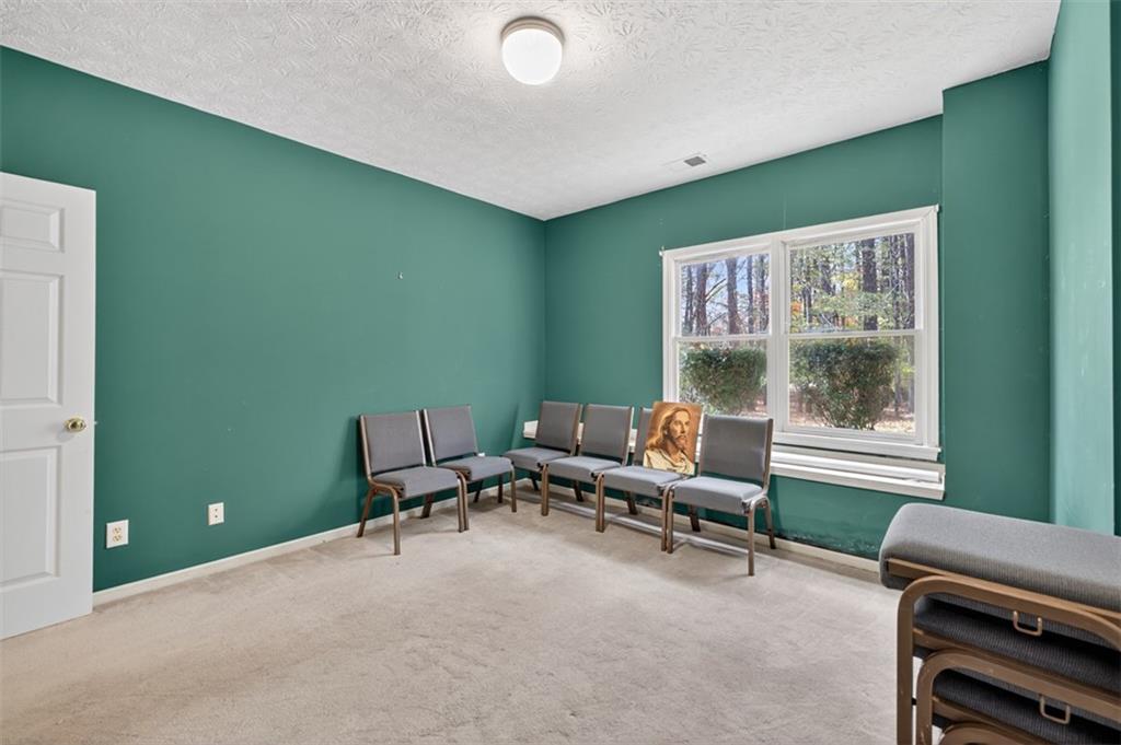 3357 Rising Fawn Trail Suwanee, GA 30024 - Photo 53 of 93 a living room with furniture and a window