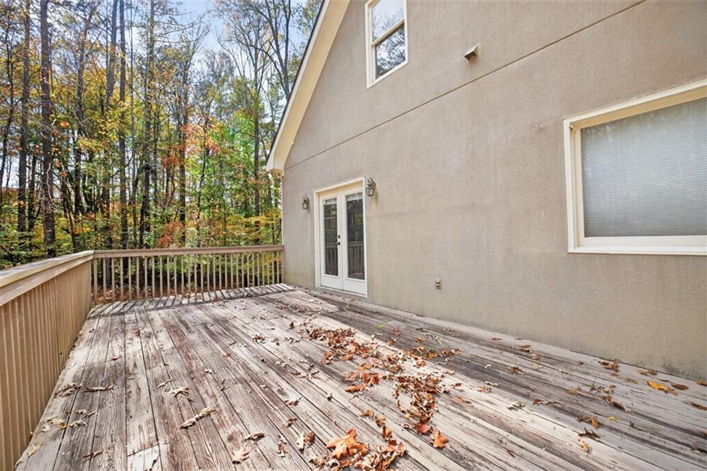 3357 Rising Fawn Trail Suwanee, GA 30024 - Photo 59 of 93 a view of balcony with wooden floor and fence