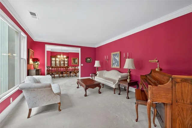 a living room with furniture fireplace and flat screen tv