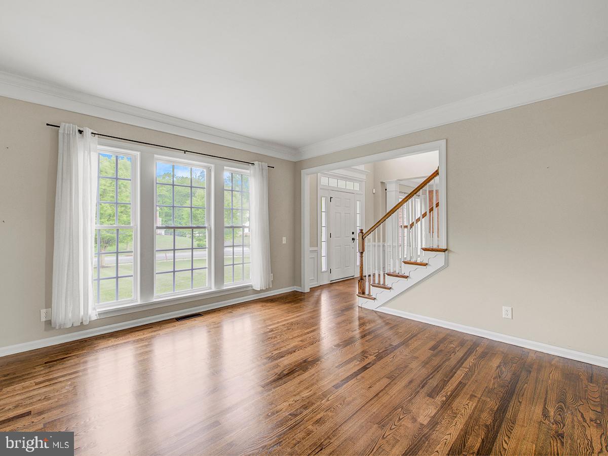 540 Morgan Drive Mickleton, NJ 08056 - Photo 11 of 33 a view of an empty room with wooden floor and a window