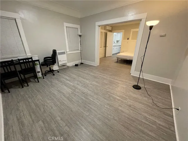 a living room with furniture and a ceiling fan