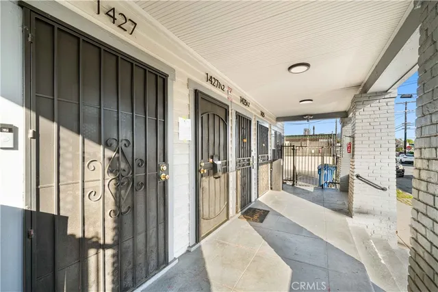 a very nice looking room with a large window and chandelier