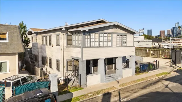 a view of multiple houses with a street