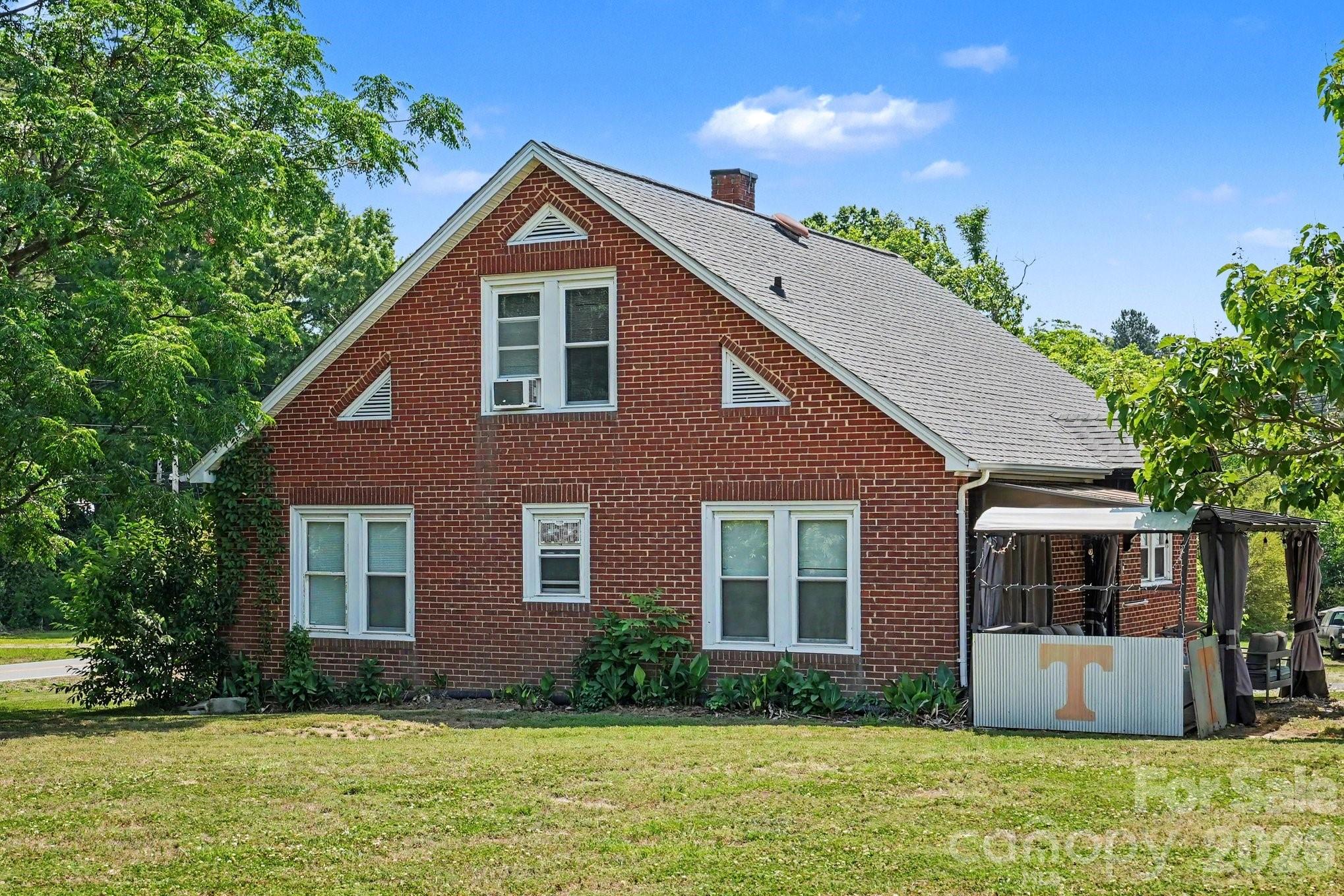 24359 Ridgecrest Road Locust, NC 28097 - Photo 20 of 26 a front view of a house with garden