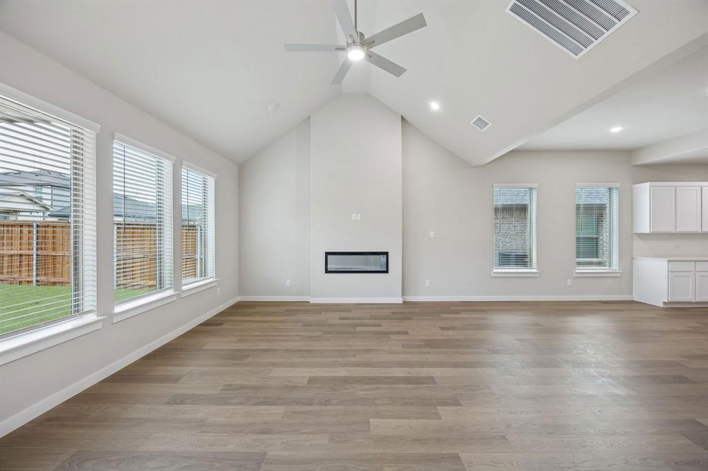 2104 Sunshining Road Princeton, TX 75407 - Photo 16 of 39 Living Room in the Stanley II home plan by Trophy Signature Homes – REPRESENTATIVE PHOTO