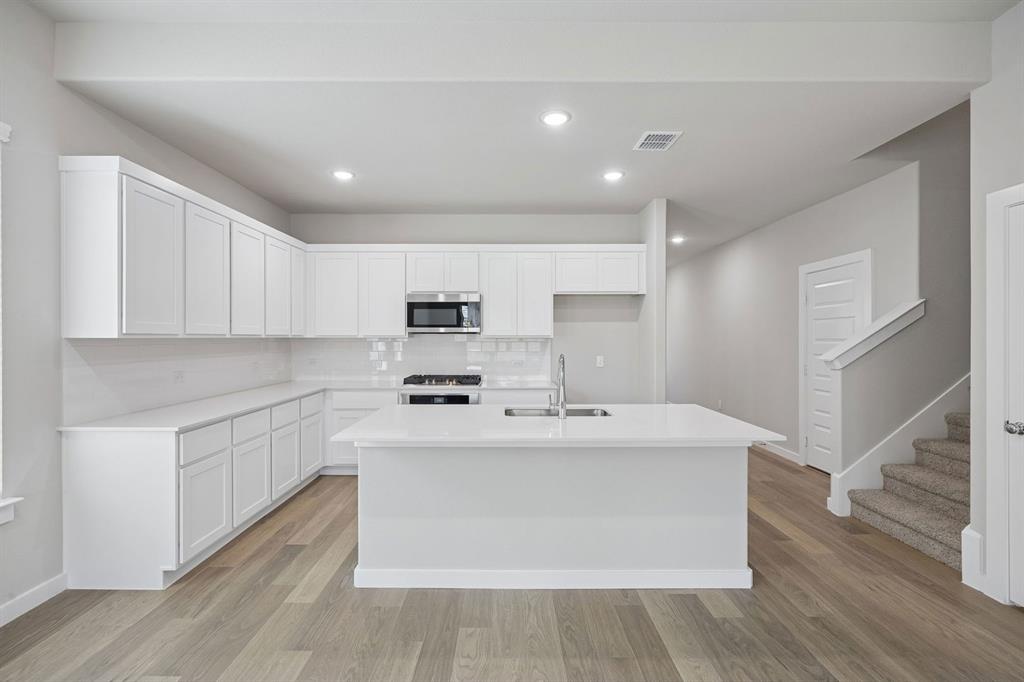 2104 Sunshining Road Princeton, TX 75407 - Photo 8 of 39 Kitchen in the Stanley II home plan by Trophy Signature Homes – REPRESENTATIVE PHOTO