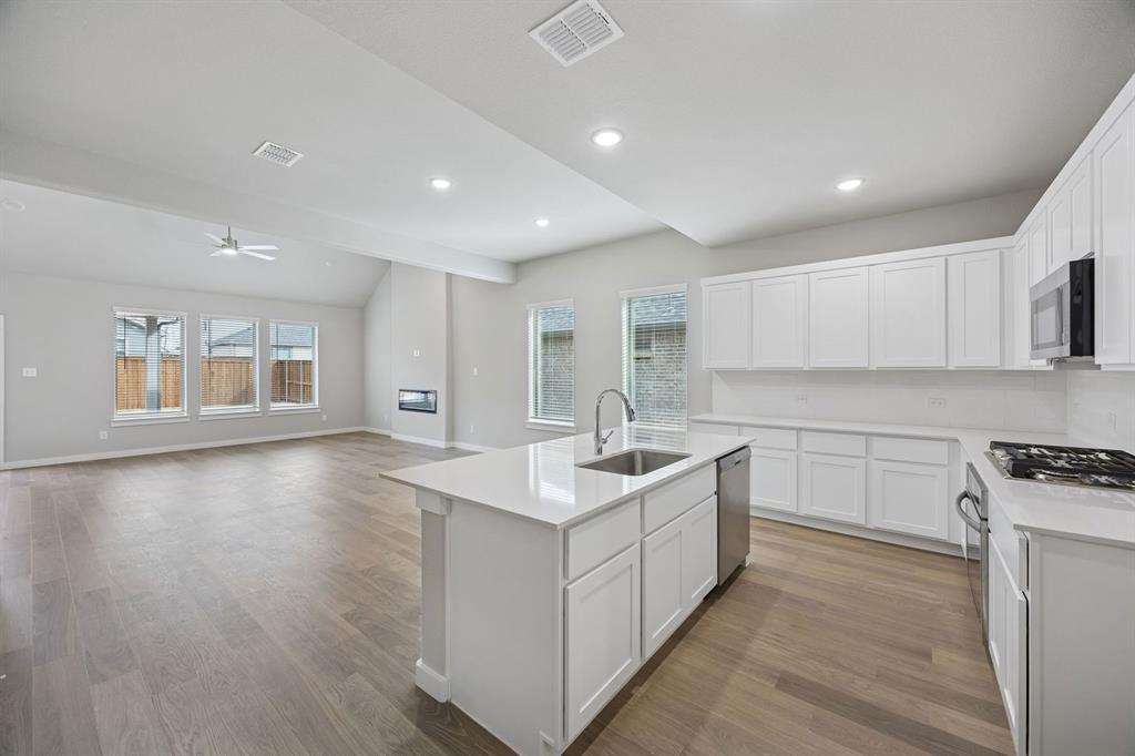 2104 Sunshining Road Princeton, TX 75407 - Photo 9 of 39 Kitchen in the Stanley II home plan by Trophy Signature Homes – REPRESENTATIVE PHOTO