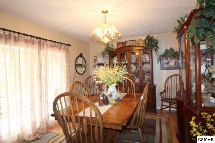 1822 New Era Road Sevierville, TN 37862 - Photo 6 of 34 a view of a dining room with furniture and chandelier