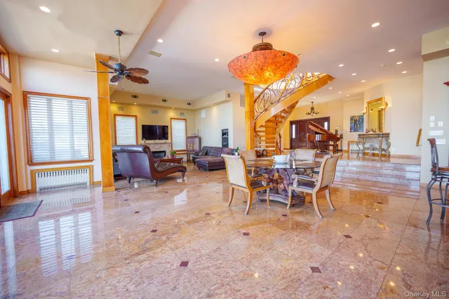 a view of a big room with table and chairs