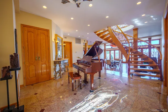 a room with lots of wooden furniture and stairs