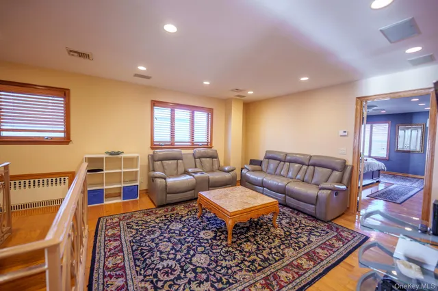 a living room with furniture and a rug