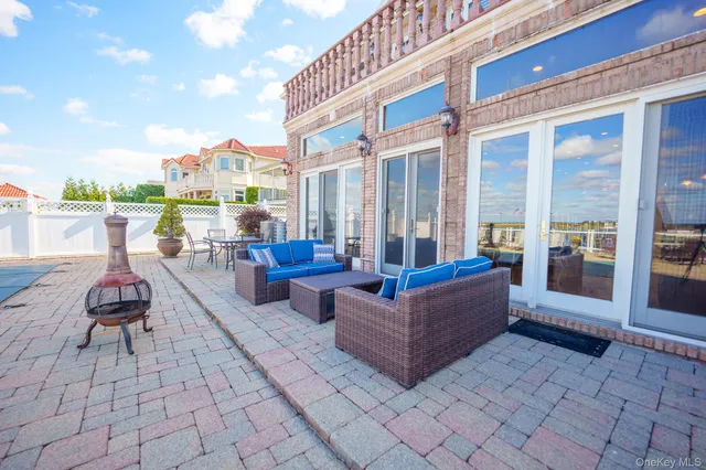 a building outdoor space with patio furniture and a couch