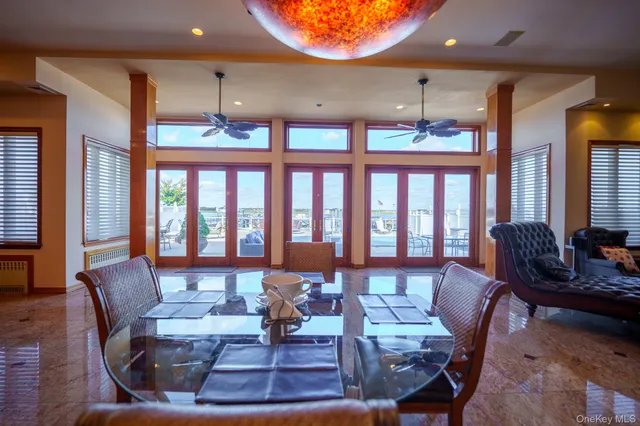 a living room with furniture a rug and a large window