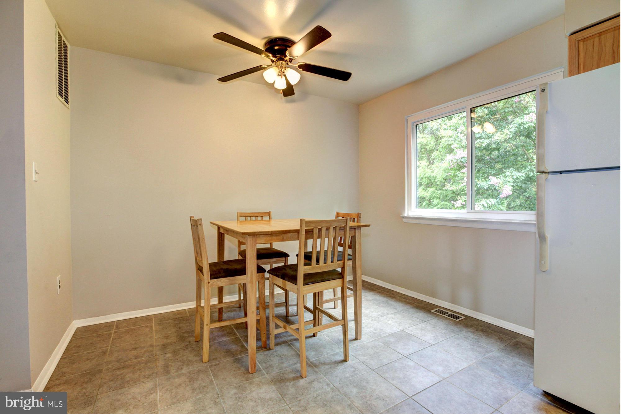 8933 Centerway Road Gaithersburg, MD 20879 - Photo 15 of 29 a dining room with furniture and window