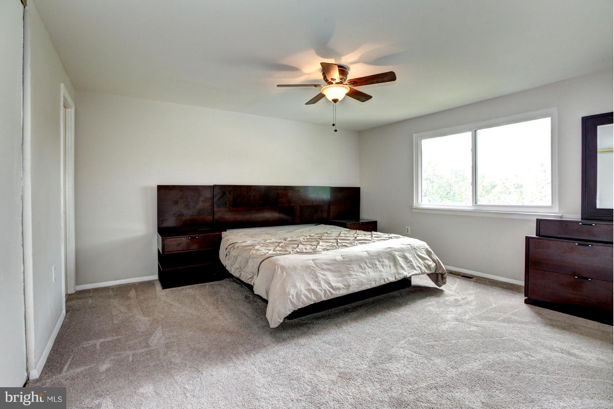 8933 Centerway Road Gaithersburg, MD 20879 - Photo 17 of 29 a bedroom with a bed and window