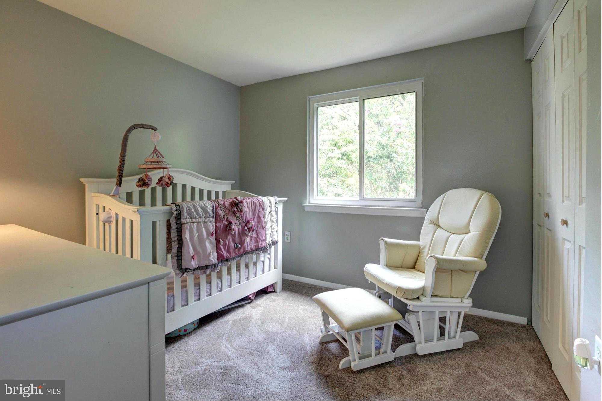 8933 Centerway Road Gaithersburg, MD 20879 - Photo 22 of 29 a bedroom with furniture and windows