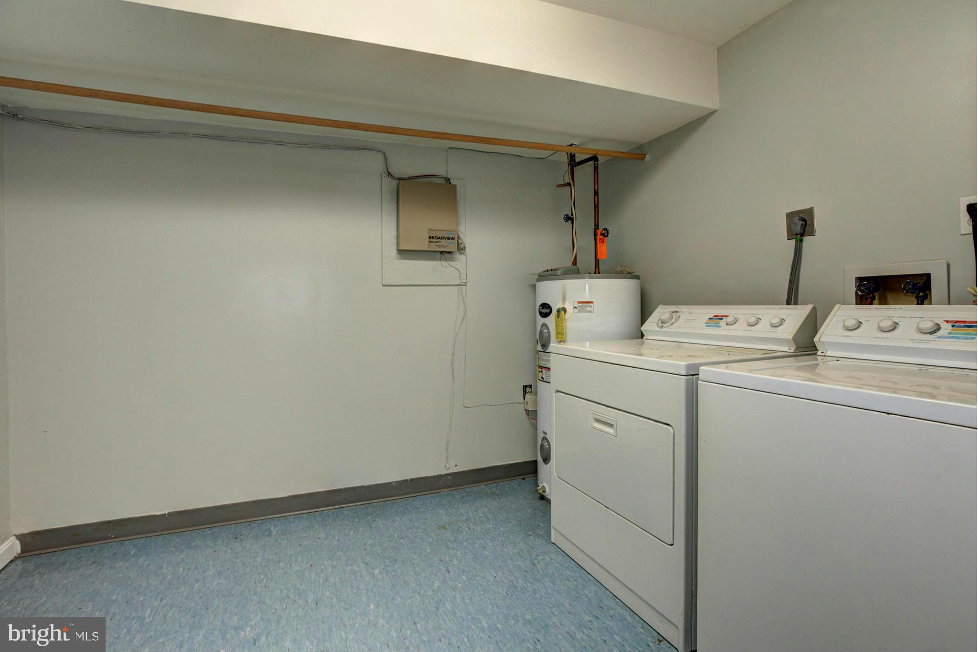 8933 Centerway Road Gaithersburg, MD 20879 - Photo 28 of 29 a utility room with dryer and washer