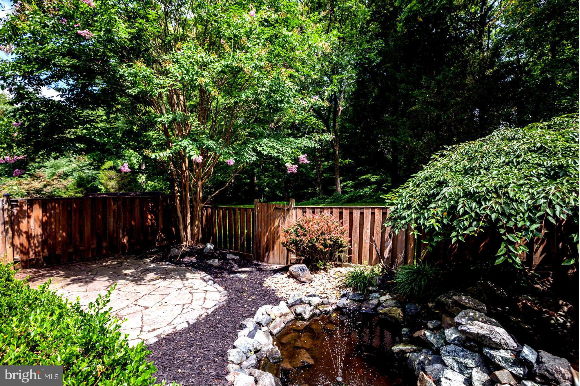 8933 Centerway Road Gaithersburg, MD 20879 - Photo 7 of 29 a view of garden with wooden fence