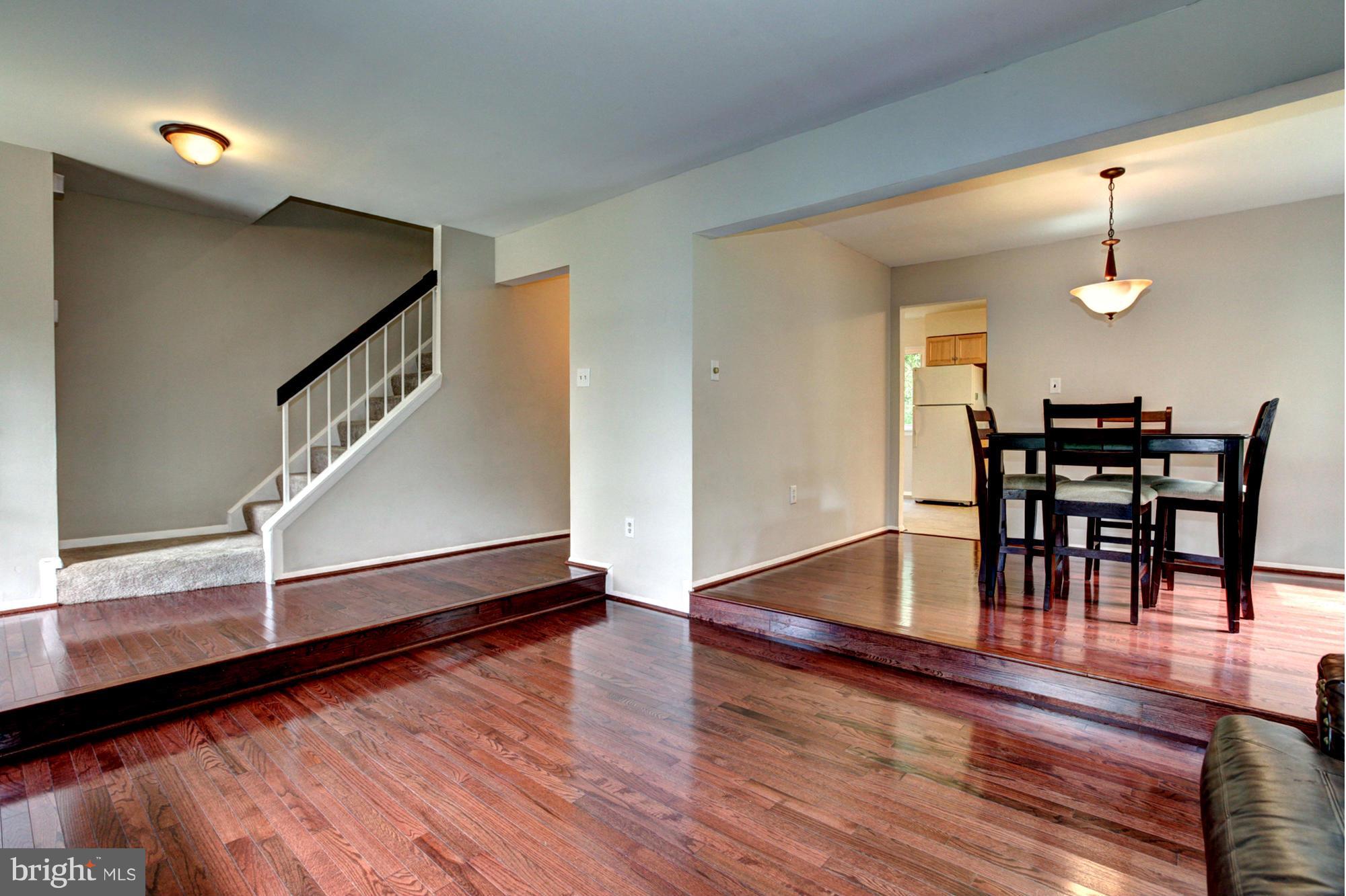 8933 Centerway Road Gaithersburg, MD 20879 - Photo 9 of 29 a view of dining room with furniture and wooden floor