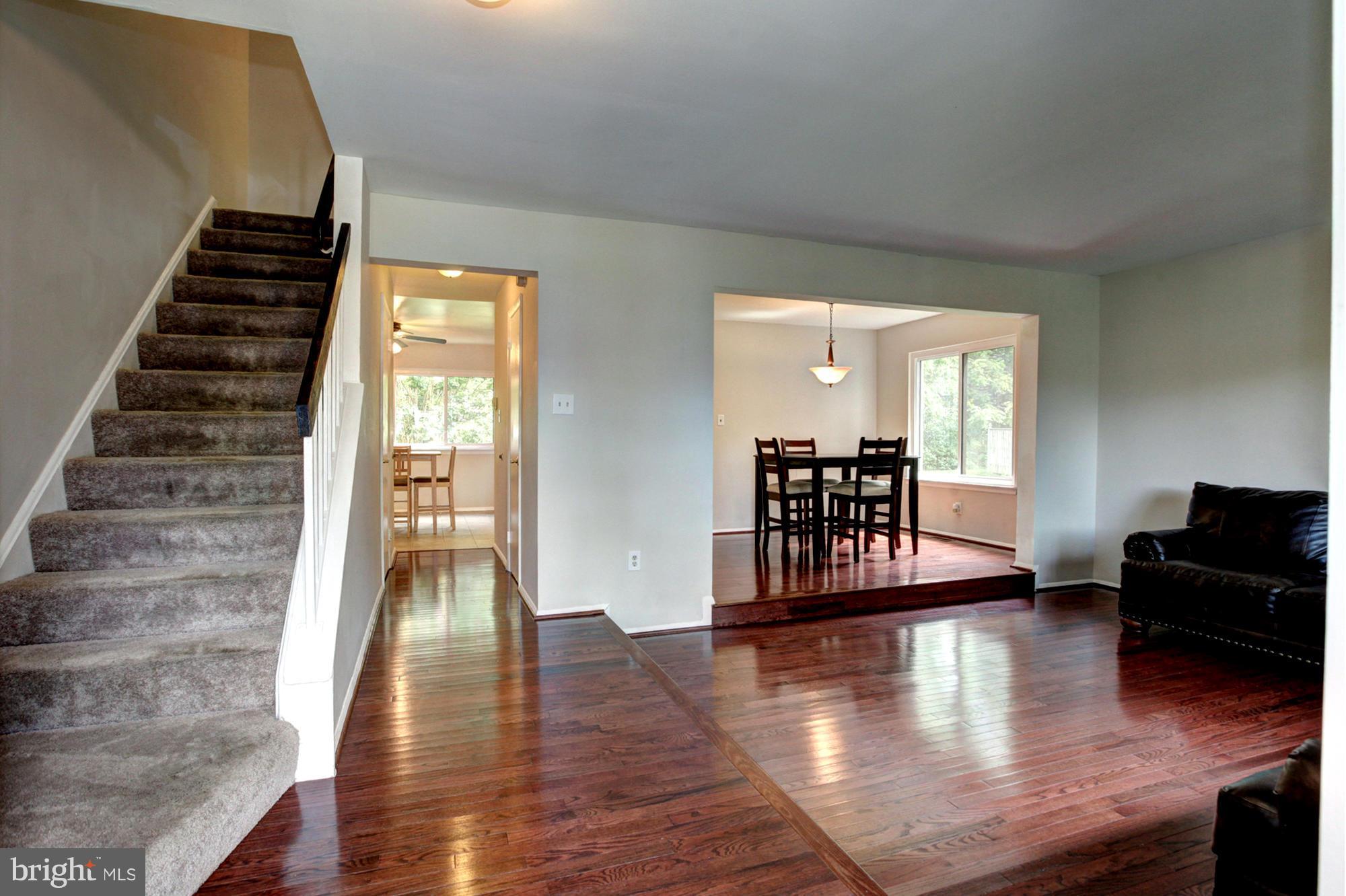 8933 Centerway Road Gaithersburg, MD 20879 - Photo 10 of 29 a living room with furniture and wooden floor