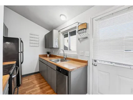 a bedroom with a bed and a potted plant