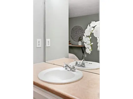 a view of building with cars parked