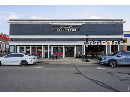 a view of a street with sitting area