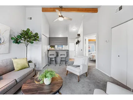 a kitchen with kitchen island a counter top space a sink stainless steel appliances and cabinets