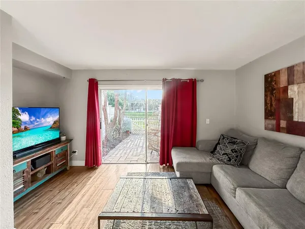 a living room with furniture and a rug